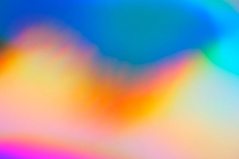 Color Psychology - a blurry image of a rainbow colored background