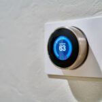 Smart Thermostat - gray Nest thermostat displaying at 63
