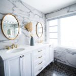 Bathroom Renovation - a bathroom with two sinks and a large mirror