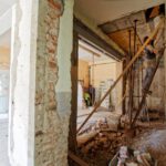 Renovation Permits - man climbing on ladder inside room