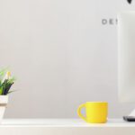 Small Decor Updates - yellow ceramic mug beside gray aluminum iMac